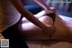 A woman getting a massage on a bed.