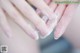 A close up of a person's hands with soap on them.